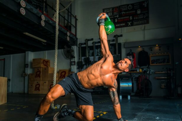 man in black shorts and black tank top doing push up