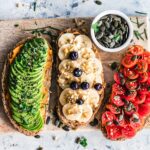 assorted fruits and vegetable on brown wooden chopping board