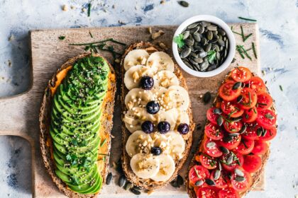 assorted fruits and vegetable on brown wooden chopping board